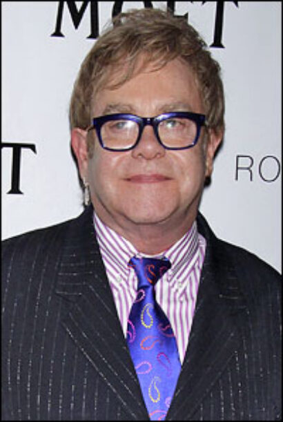 //assets.playbill.com/editorial/85e9bef0a8bd33b35effee5b65e6a6f8-eltonjohnweek200.jpg