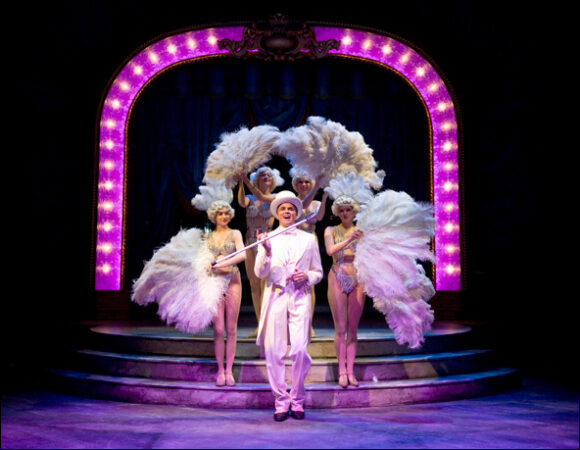 Brent Barrett as Benjamin Stone (center) with showgirls Jenny Guse, Christina Myers, Amanda Tanguay and Amanda Kroiss