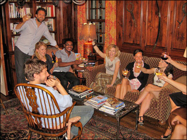 At a welcome party on their first night in KC, the cast of <i>Saved</i> offers a toast to the beginning of rehearsals.  The party was hosted by KC Rep board member Laura Hall and her husband David.