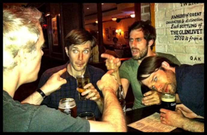 The cast engaging in philosophical conversation.